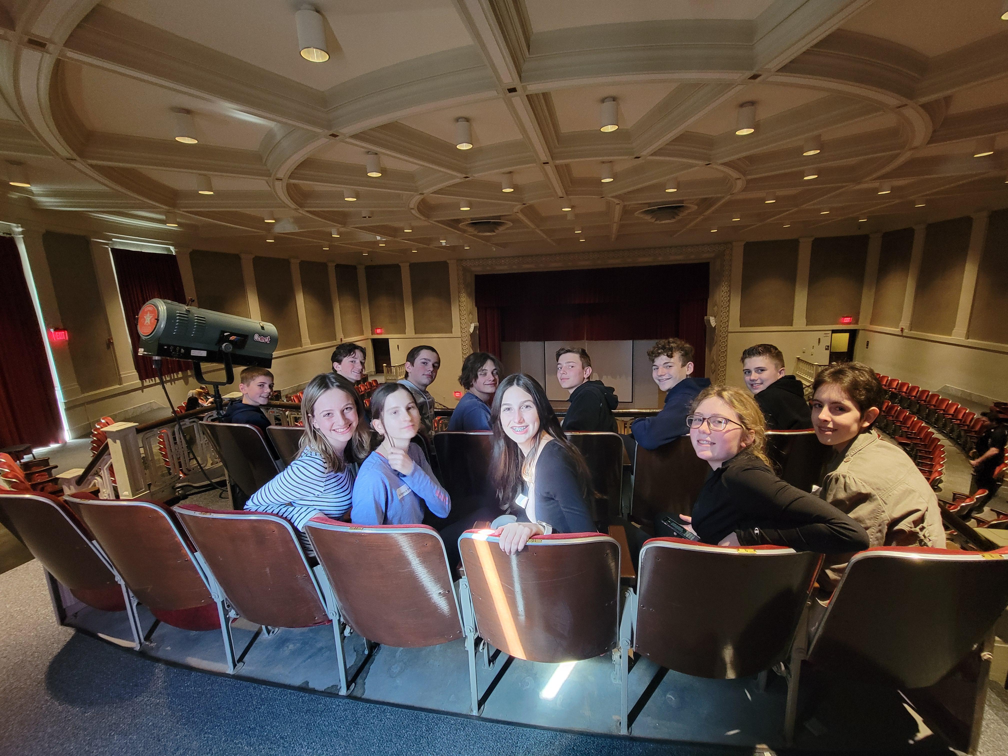 students sitting in an auditorium
